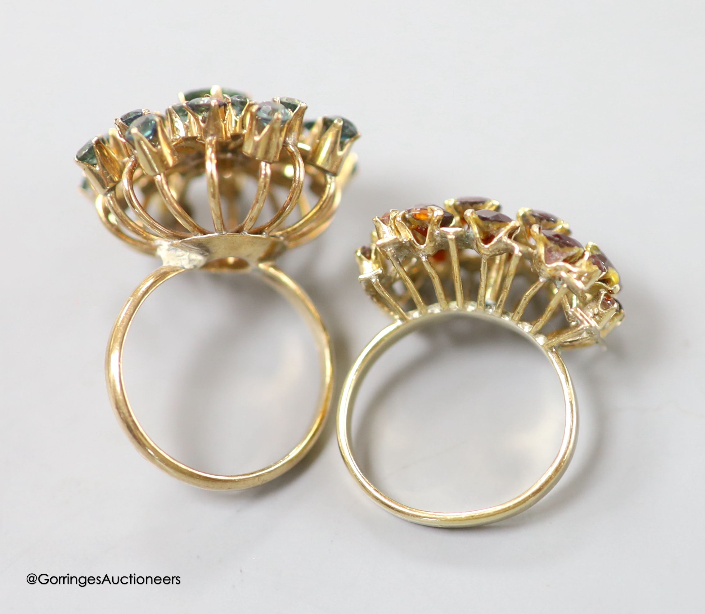 Two modern 14k and gem set cluster dress rings, including garnet, sizes K/L & M, gross 11.2 grams.